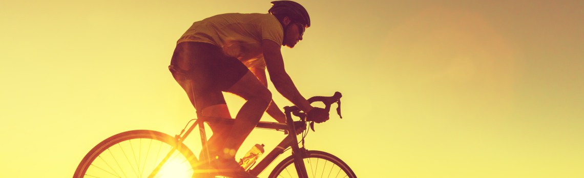 Cyclist-infront-of-a-yellow-backgroud