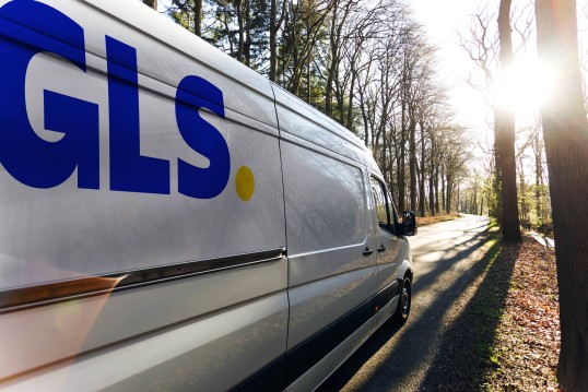 GLS vehicles charging parcels at the GLS depot