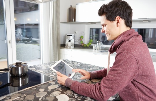 young guy sitting with ipad