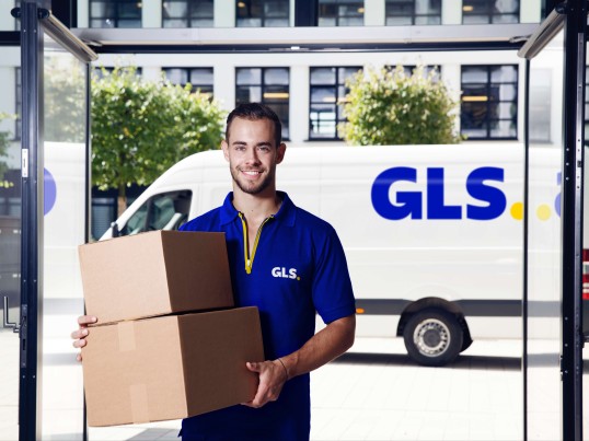 GLS driver delivering an order to a customer's store