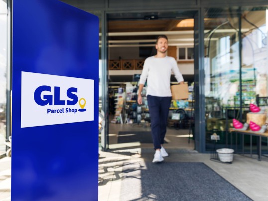 GLS delivery driver in front of ParcelShop