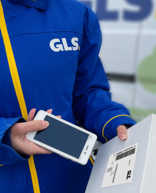  A GLS courier scanning a parcel with a POS terminal in front of the Parcel Locker.