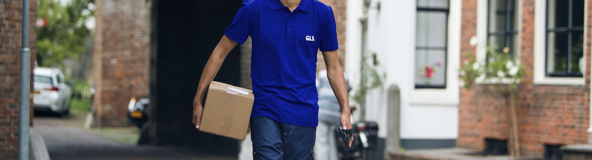 GLS deliveryman holding a parcel
