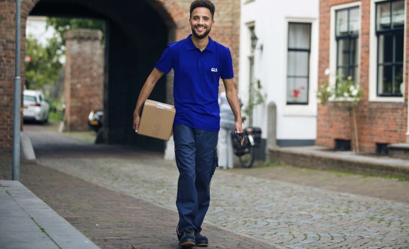 GLS deliveryman holding a parcel