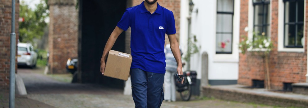 GLS deliveryman holding a parcel