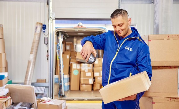 GLS depot worker scaningn a parcel