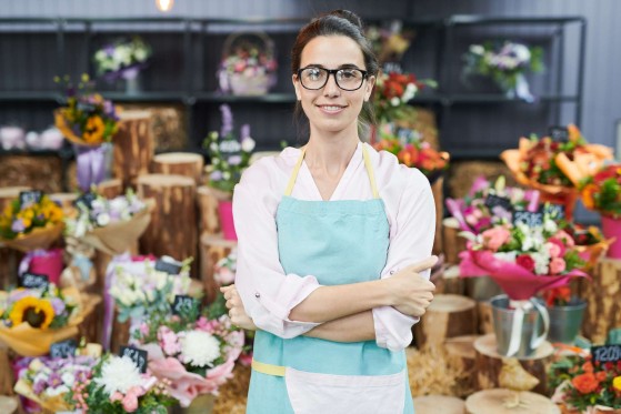 Business woman infront of her store