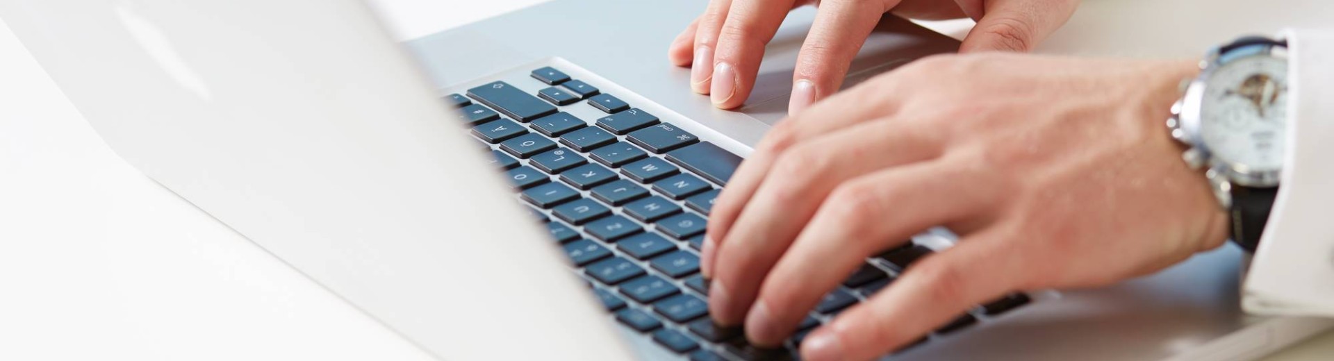 Man typing on laptop
