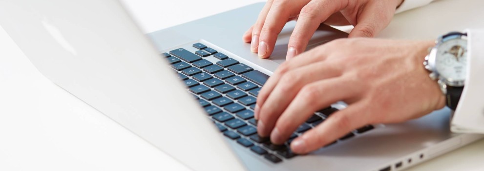 Man typing on laptop